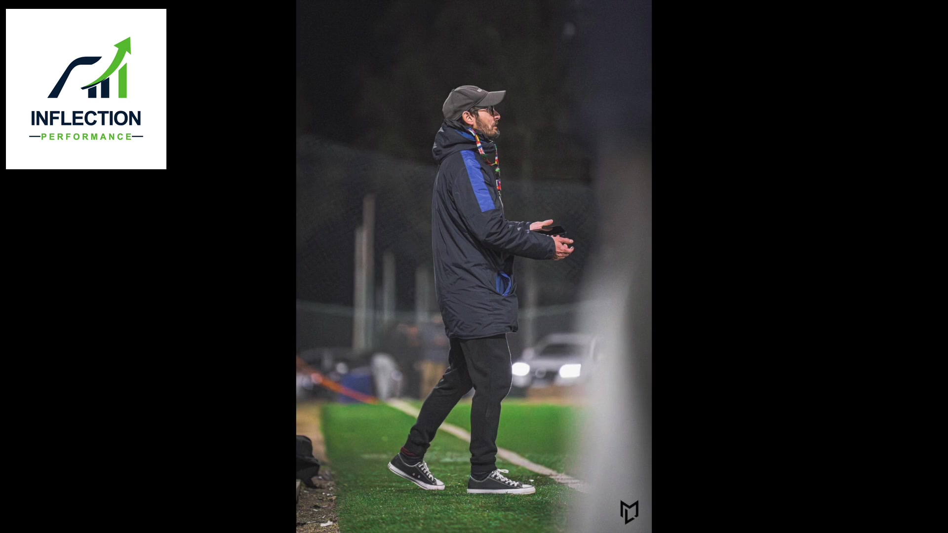 Soccer coach observing and directing performance from the sideline